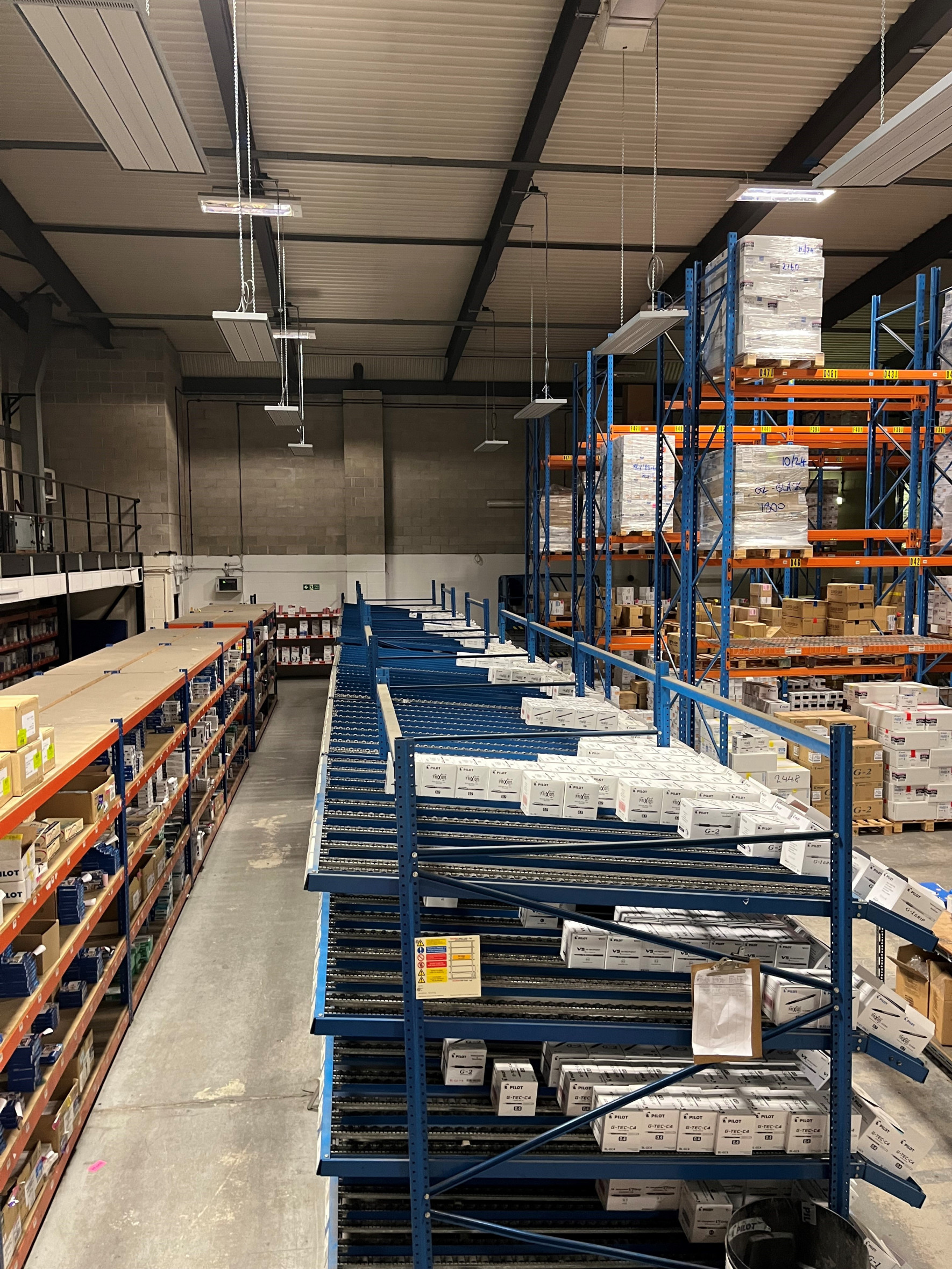 Suspended EEZ Medium wave infrared heaters in a picking area of a warehouse