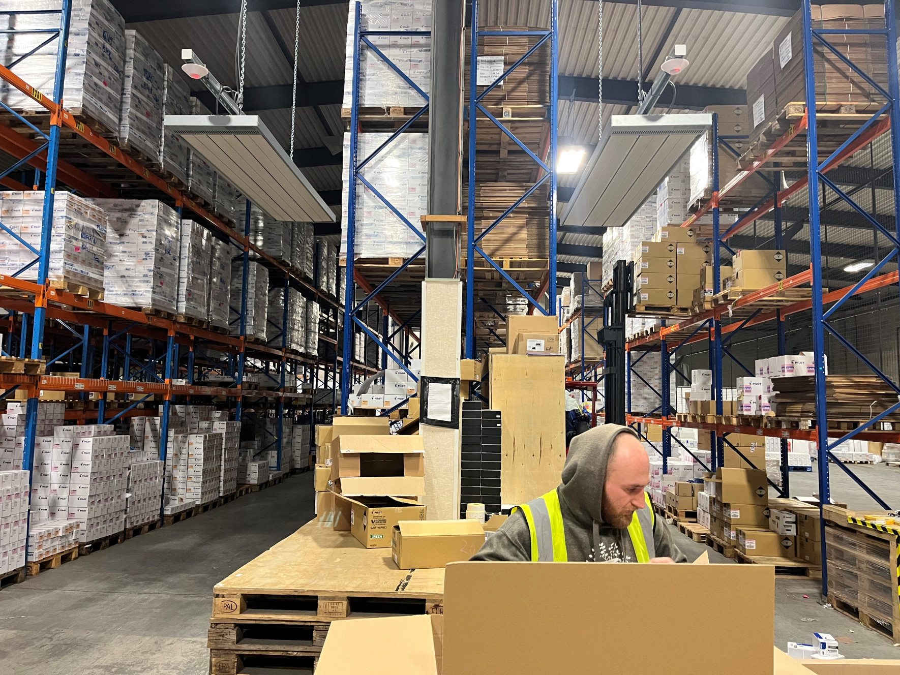 EEZ Medium Wave infrared heaters in packing bench area in a warehouse for spot heating