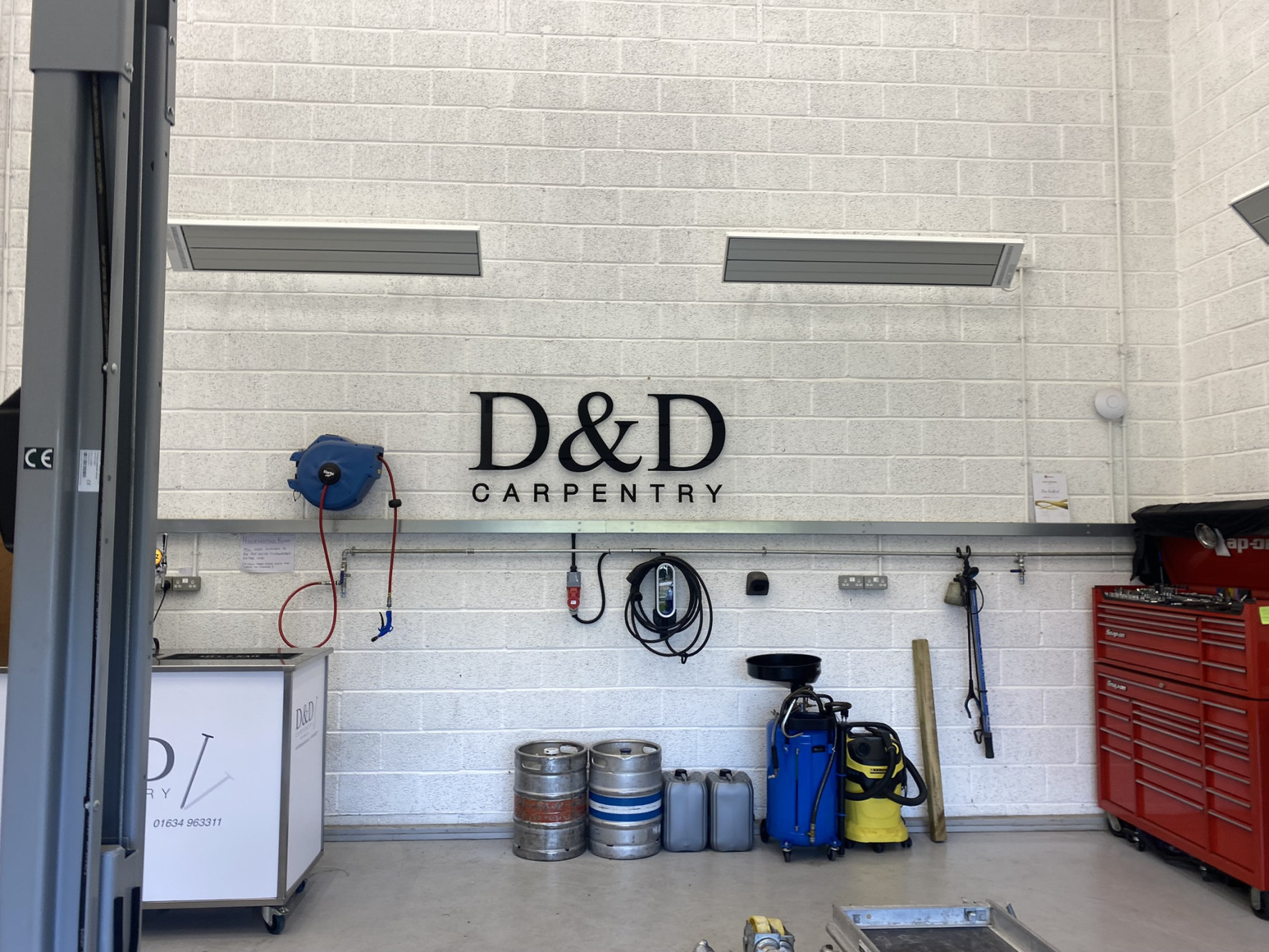 Wall mounted EEZ Medium wave infrared heater in carpentry workshop