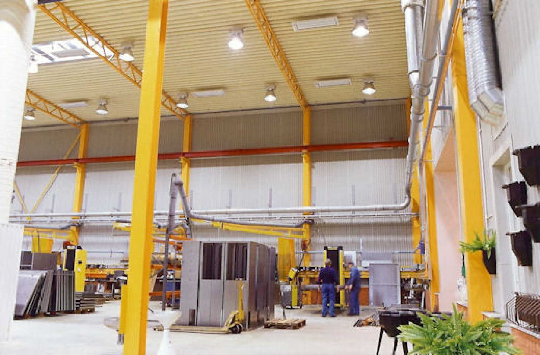 Ceiling mounted EEZ Medium Wave Infrared heaters in factory / warehouse space